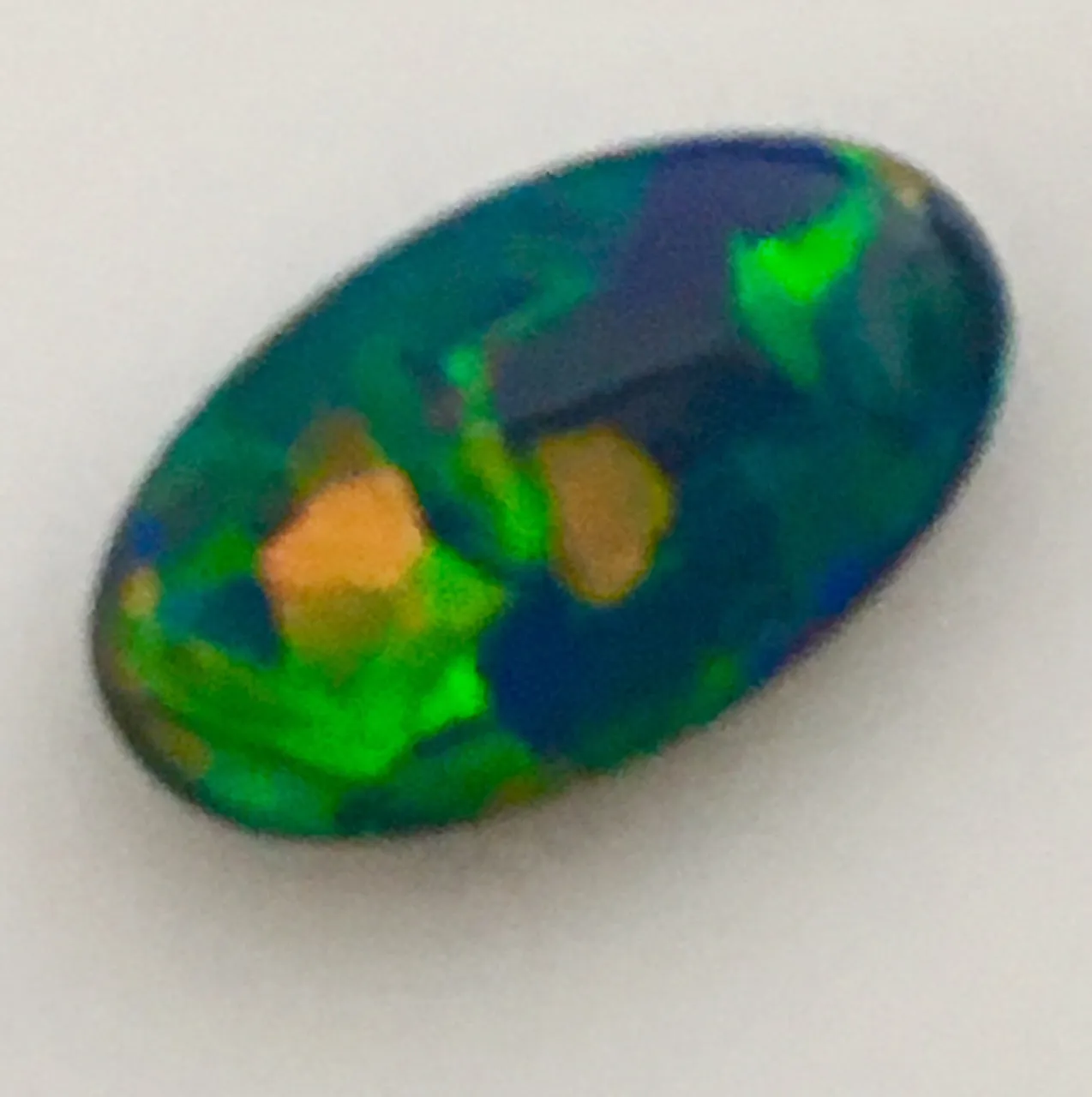 Gem Orange Gold Blue solid Black opal from Lightning Ridge